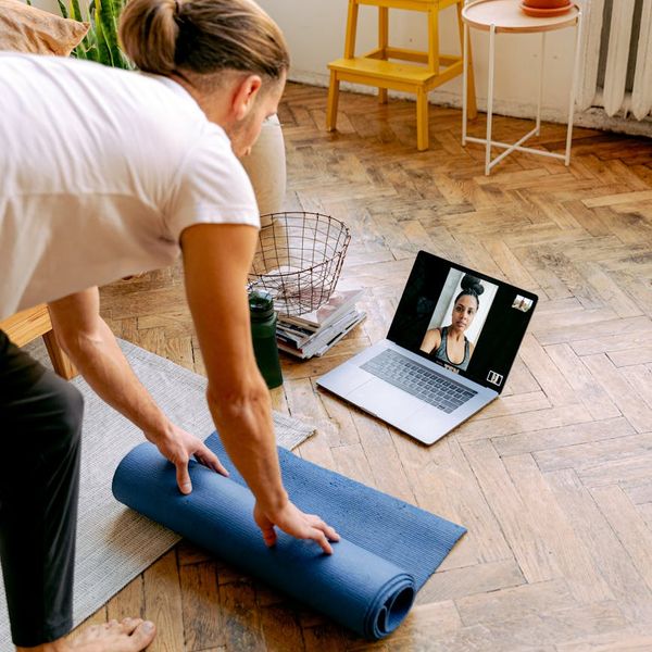Person feeling energized and stretching after a workout session.
